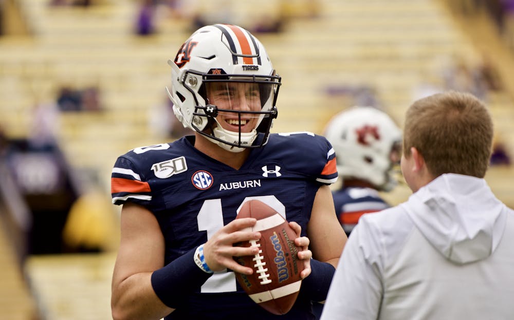 <p>Bo Nix (10) smiles while warming up for Auburn at LSU on Oct. 26, 2019, in Baton Rouge, La.</p>