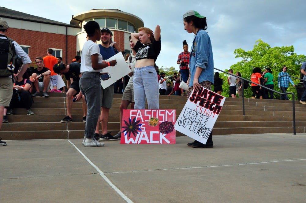 Students prepare to march down to the Green Space to protest Richard Spencer's visit on campus on Tuesday, April 18, 2017, in Auburn, Ala.