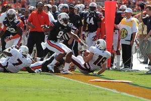 Defensive back Jermaine Whitehead pushes ULM's wide receiver Brent Leonard out of bounds. (Rebecca Croomes / PHOTO EDITOR)