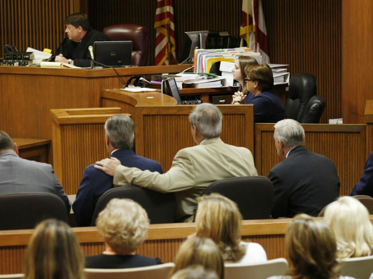 Mike Hubbard sits in the middle while attorney David McKnight has his arm around his shoulder after the Alabama Speaker Mike Hubbard Trial on Friday, June 10, 2016  in Opelika, Ala.
Todd J. Van Emst/Opelika-Auburn News/Pool