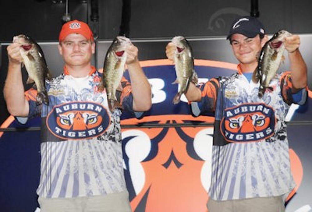 Anglers Shaye Baker and Jordan Lee celebrate after a third-place finish at the Southeast regional college fishing tournament. (Contributed)