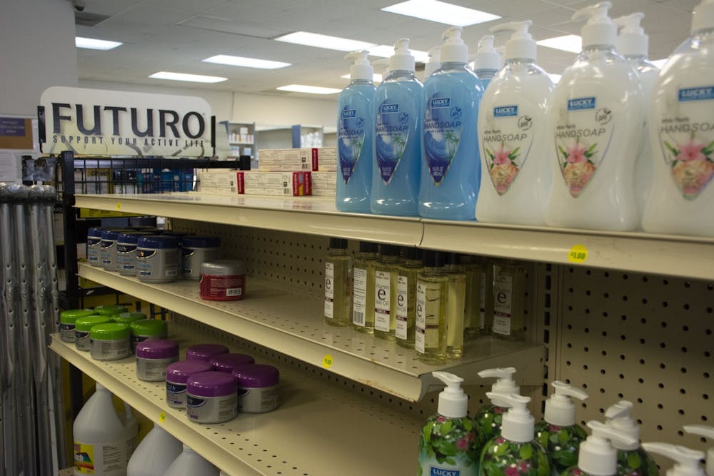 <p>A shelf once stocked with hand sanitizer lies empty in The Drug Store on March 12, 2020, in Auburn, Ala.</p>