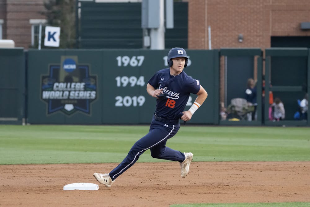 Ike Irish (#18) keeps an eye on home as he rounds second base against Arkansas at Plainsman Park on March 21st, 2024.