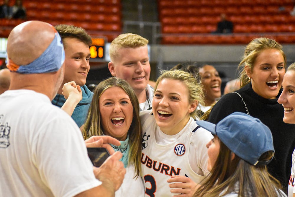January 27, 2022; Auburn, Alabama; Annie Hughes (3) celebrates with fans after a match between Auburn and Tennessee in the Auburn Arena.