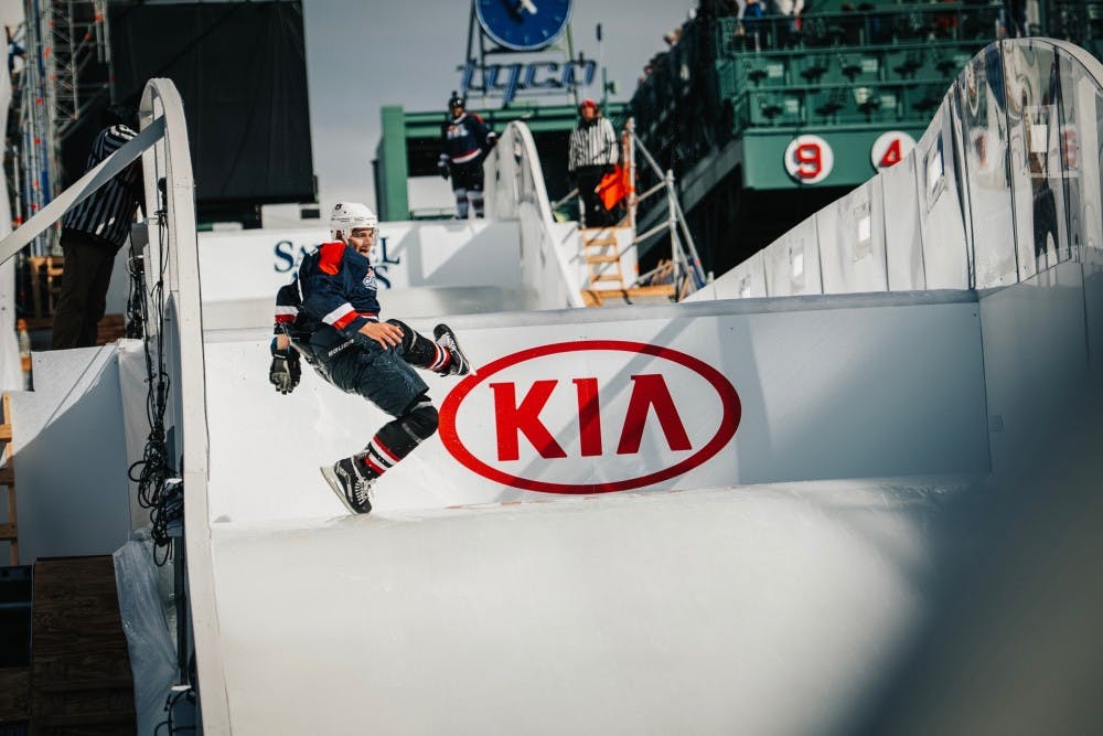 <p>Seth Baylis participates in “ice cross downhill” at Fenway Park in Boston, Mass.</p>