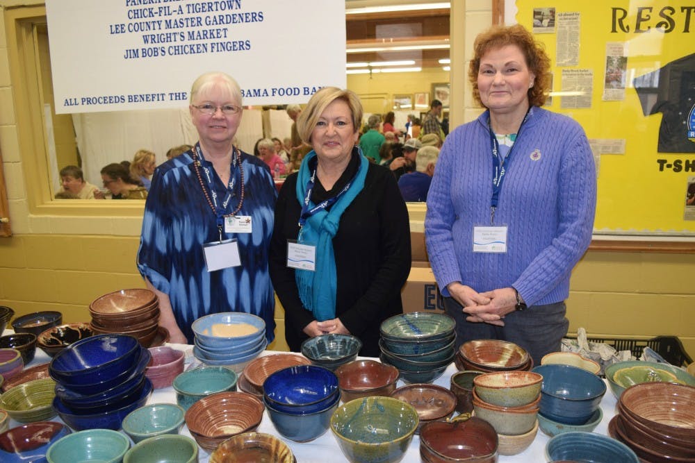 Raleine Sillman, Joyce Delamar, and Nancy Pfennighaus monitor&nbsp;the donated bowls. Third&nbsp;Annual Empty Bowls lunch on&nbsp;Saturday, February 13 at the Denson Drive Recreation Studio in Opelika, AL.