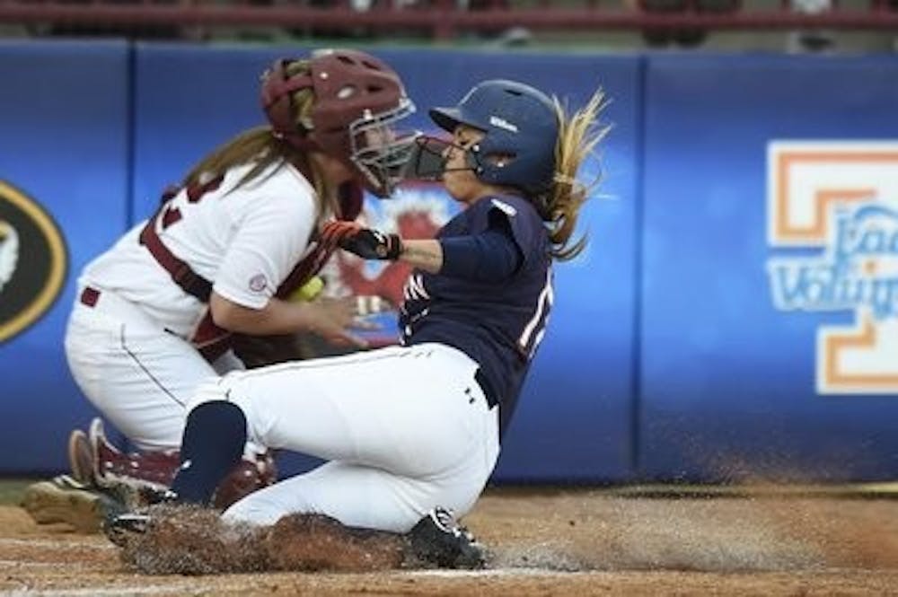 Branndi Melero (17) slides into home. Alabama vs Auburn in the SEC Tournament in Columbia, South Carolina on Thursday, May 8, 2014. (Zach Bland / Auburn Athletics)