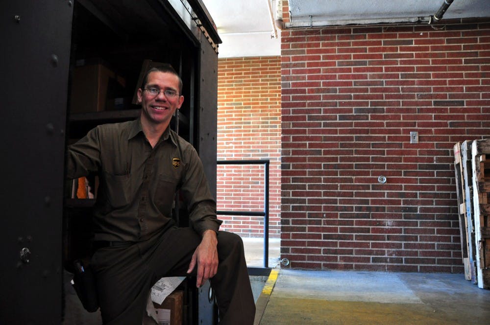Richard Oden stands in a UPS truck at the Haley Center loading dock on Thursday, March 2, 2017, in Auburn, Ala.