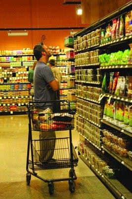 Todd Gilbert peruses the selection of organic foods at Earth Fare on Opelika Road. He likes to shop at Earth Fare for all of his organic needs. (Alex Sager / ASSOCIATE PHOTO EDITOR)