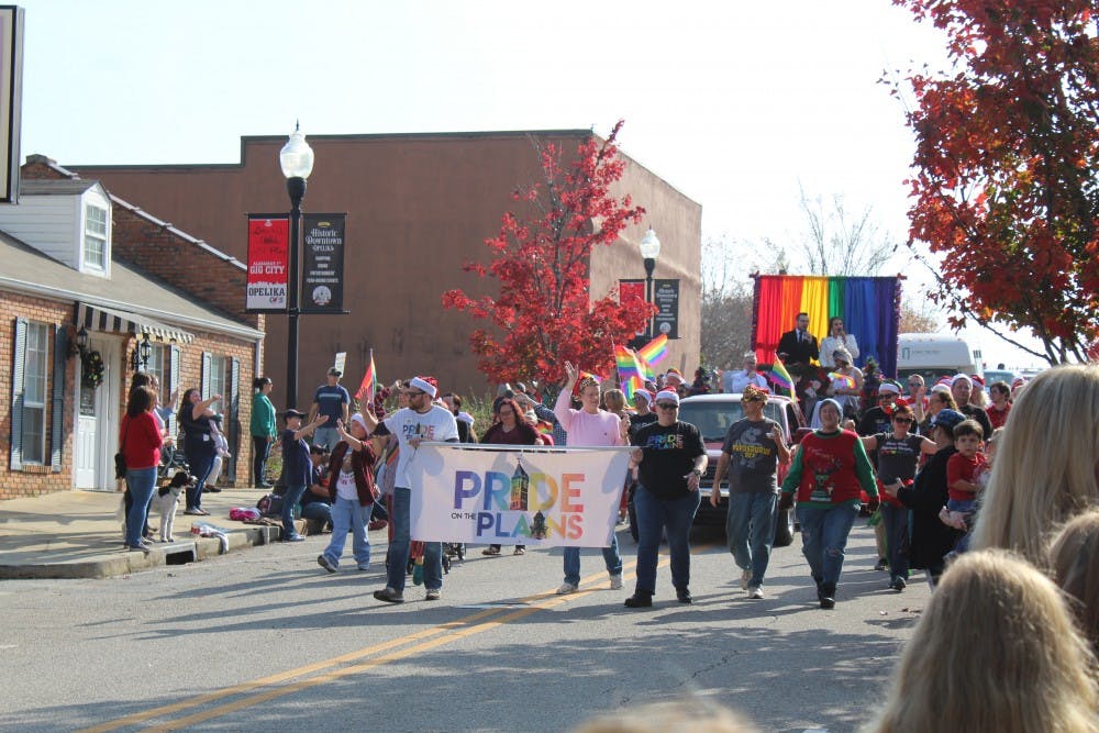 Pride on the Plains, a local LGBTQ organization, marches through the annual Opelika Christmas parade on Dec. 2, 2017, in Opelika, Ala.