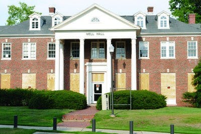 Windows have been boarded and doors have been locked at Alpha Psi, Mell Hall, and Sewell Hall in preparation for demolition. All are scheduled to go down by the end of the summer. (Christen Harned / PHOTO EDITOR)