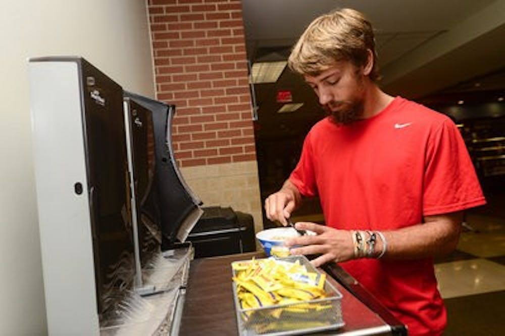Patton Chambers warms his oatmeal in the Student Center every morning.