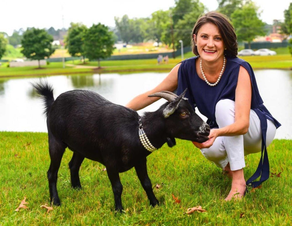 Mary Wynne Kling, democratic candidate running for House District 79, poses with a goat. (Contributed by Mary Wynne Kling)