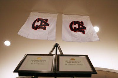 Two flags hang in the Student Center in memory of Ed Christian and Ladarious Phillips. (Courtesy of Rebecca Croomes)