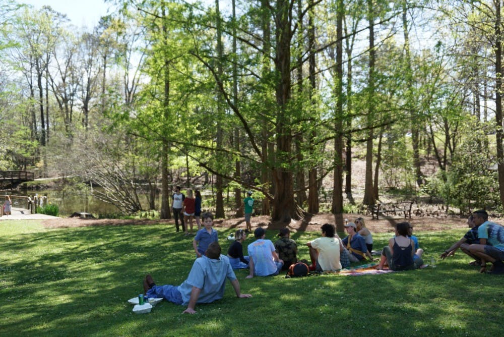 Attendees listen to live music during&nbsp;the Azalea Festival at Auburn University's Donald E. Davis Arboretum on Saturday, March 31, 2018, in Auburn, Ala.