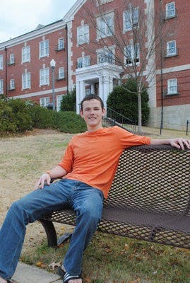 Daniel Brownfield relaxes on a bench outside of Harper Hall. (Maria Iampietro / Associate Photo Editor)