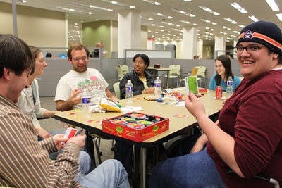 Students at last year's RBDpalooza enjoy a game of Apples to Apples in the library. (Emily Adams / photo editor)