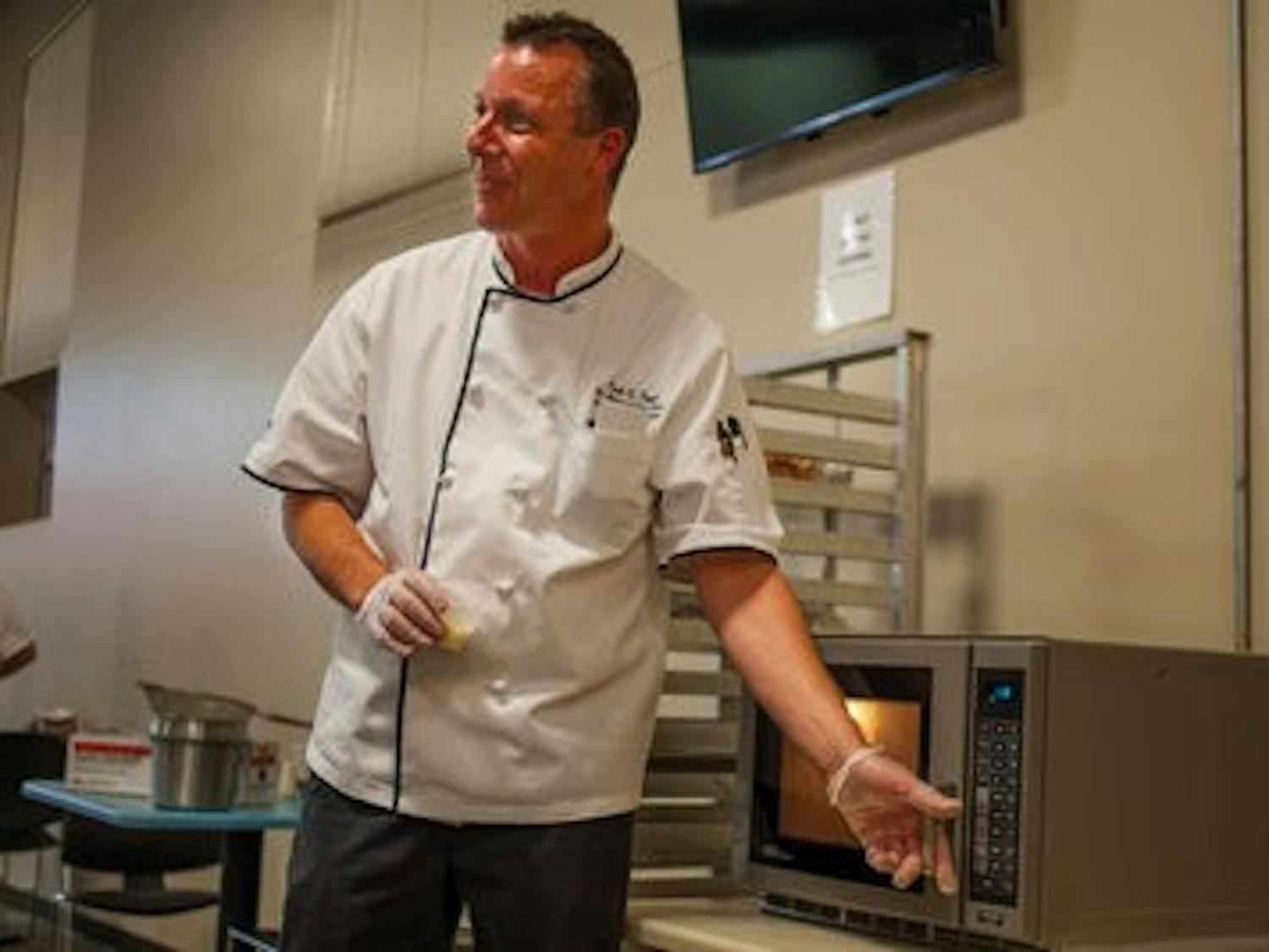 Emil Topel, senior executive chef of Chartwells, teaches students how to eat healthy and locally. (Kenny Moss | Photographer)