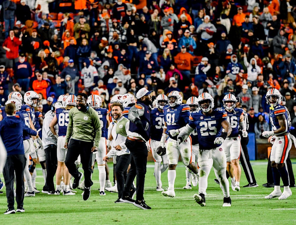 <p>Coach Carnell "Cadillac" Williams celebrates with his team in Jordan-Hare Stadium against Texas A&amp;M on November 12, 2022.&nbsp;</p>
