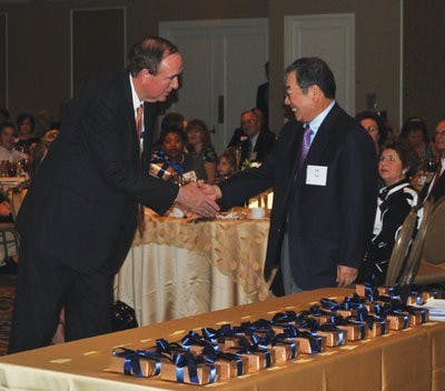Y.Y. Lee, professor of chemical engineering, accepts his endowment from President Gogue. (Elaine Busby / Assistant Photo Editor)
