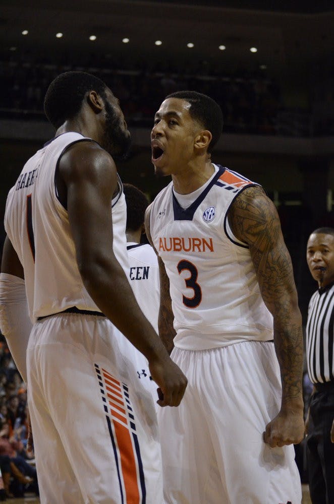 KT Harrell and Chris Denson celebrating after a successful play. Sarah May/ASSISTANT PHOTO EDITOR.