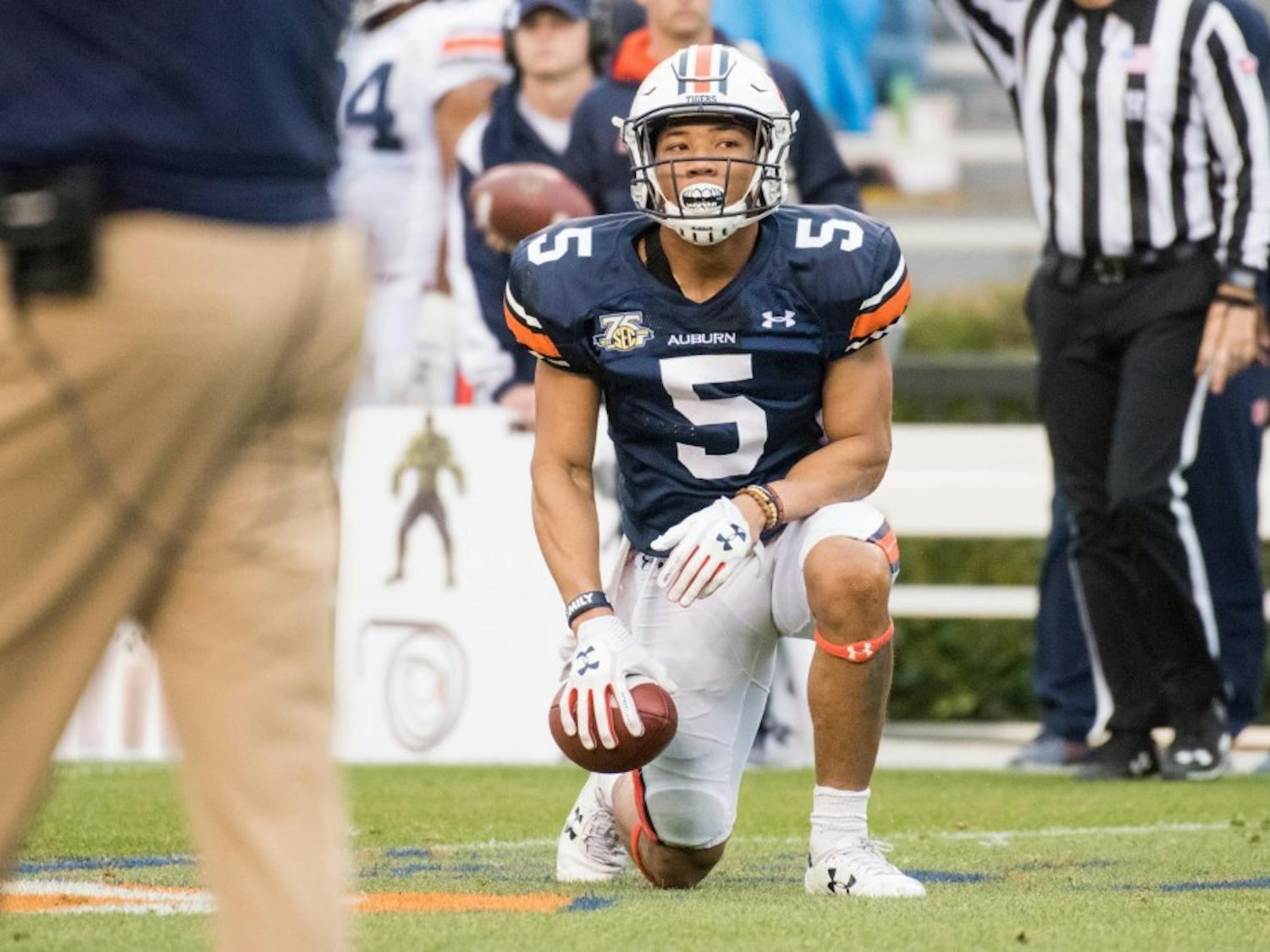 Devan Barrett (5) takes a knee after being knocked down during Auburn's A-Day game on Saturday, April 7, 2018, in Auburn, Ala.