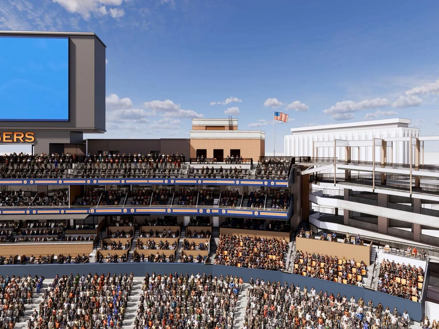 A large crowd fills a multi-tiered stadium with a prominent LED screen displaying text above a section labeled "TIGERS."