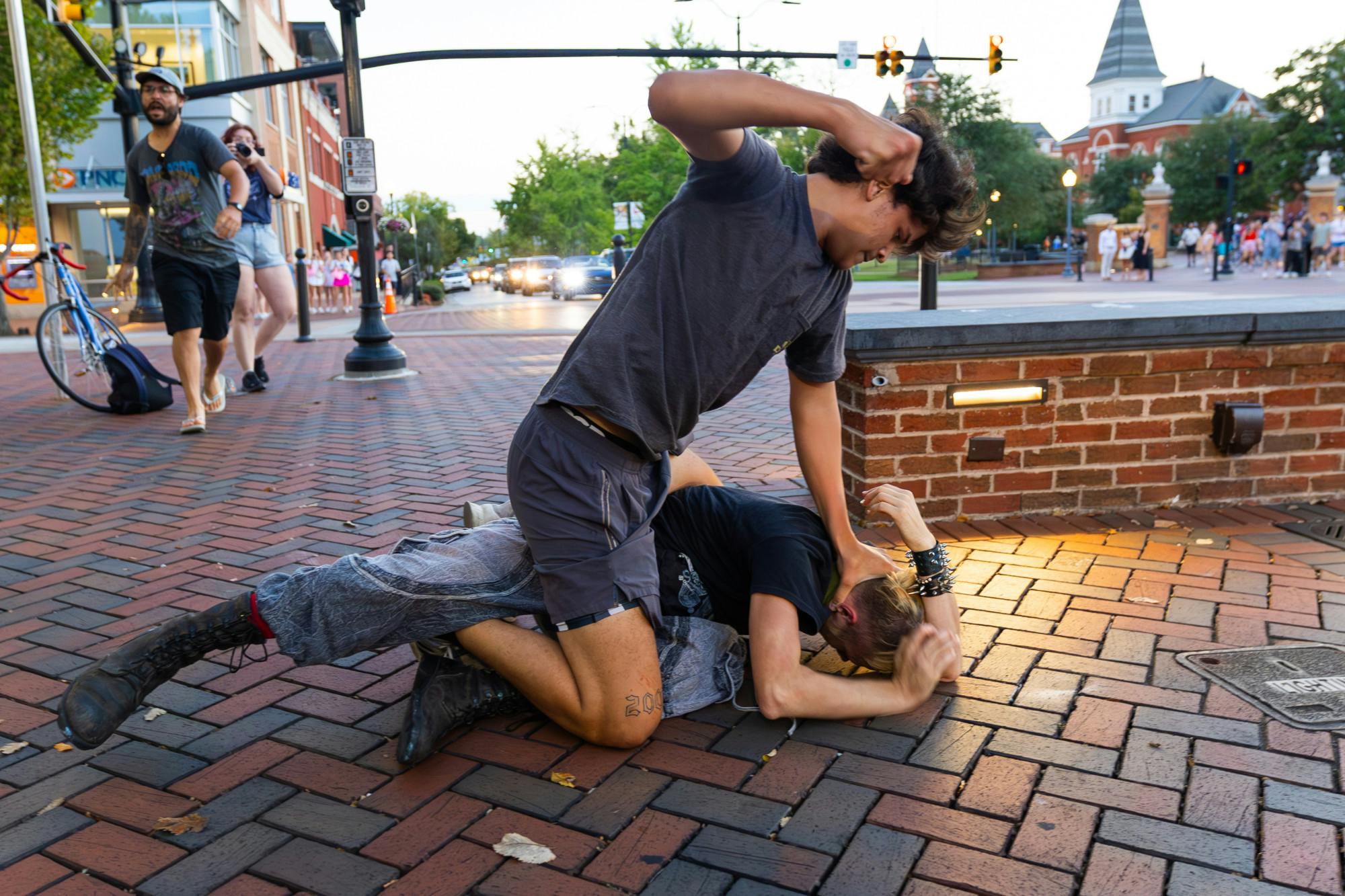 Several protest Israel-Hamas war at Toomer's Corner following day-long art demonstration