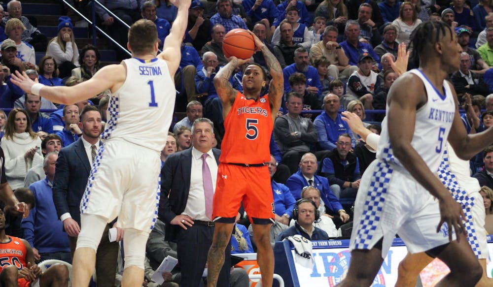 <p>J'Von McCormick (5) shoots from 3 during Auburn at Kentucky on Feb. 29, 2020, in Lexington, Ky.</p>