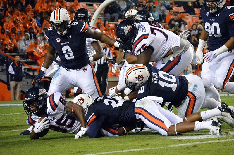 Auburn defense makes a tackle.

Emily Enfinger | Assistant Photo Editor
