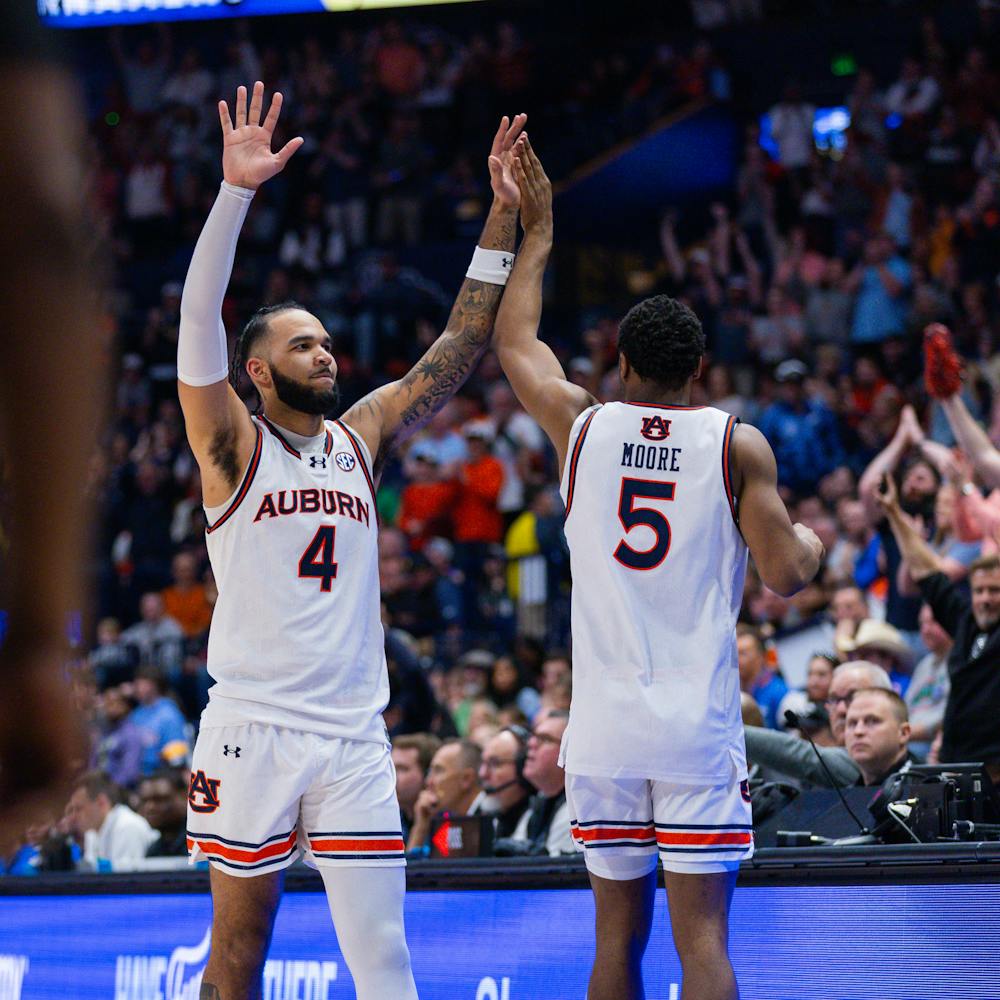Johni Broome checks out of the SEC Tournament Finals while acknowledging the crowd on March 17, 2024