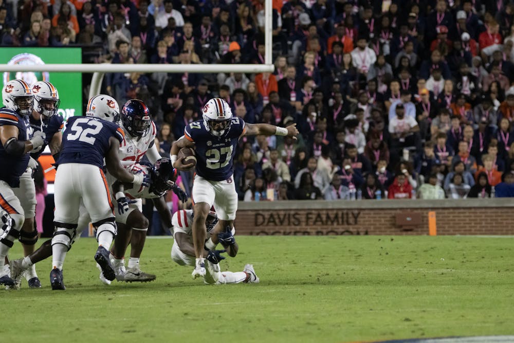 Jarquez Hunter (#28) breaks away from an Ole Miss tackler in Jordan-Hare Stadium on October 21st, 2023.