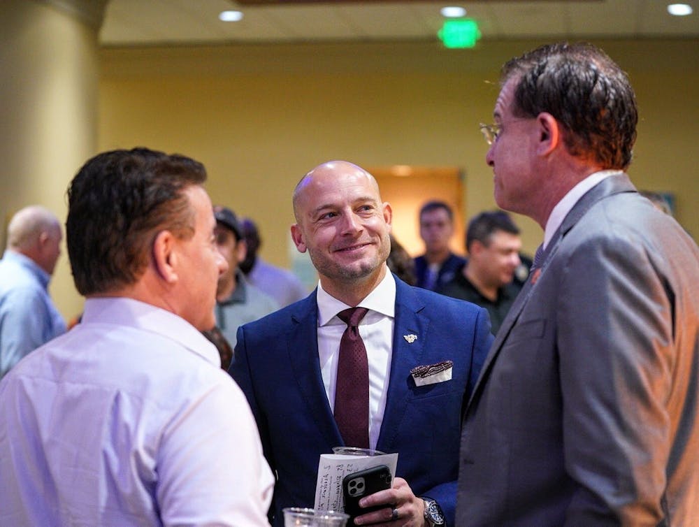 <p>P.J. Fleck (middle) and Gus Malzahn (right) before the Outback Bowl joint press conference in Tampa, Fla. Photo via @GopherFootball on Twitter.</p>
