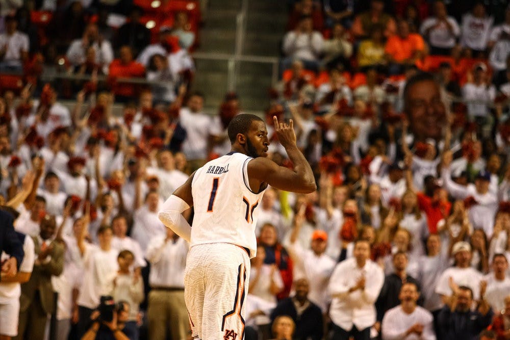 <p>KT Harrell holds up his fingers after his first 3 of the game. (Kenny Moss | Photographer)</p>