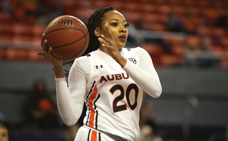 Unique Thompson (20) looks to pass after an offensive rebound during Auburn women's basketball vs. Mississippi State on Feb. 20, 2020, in Auburn, Ala.