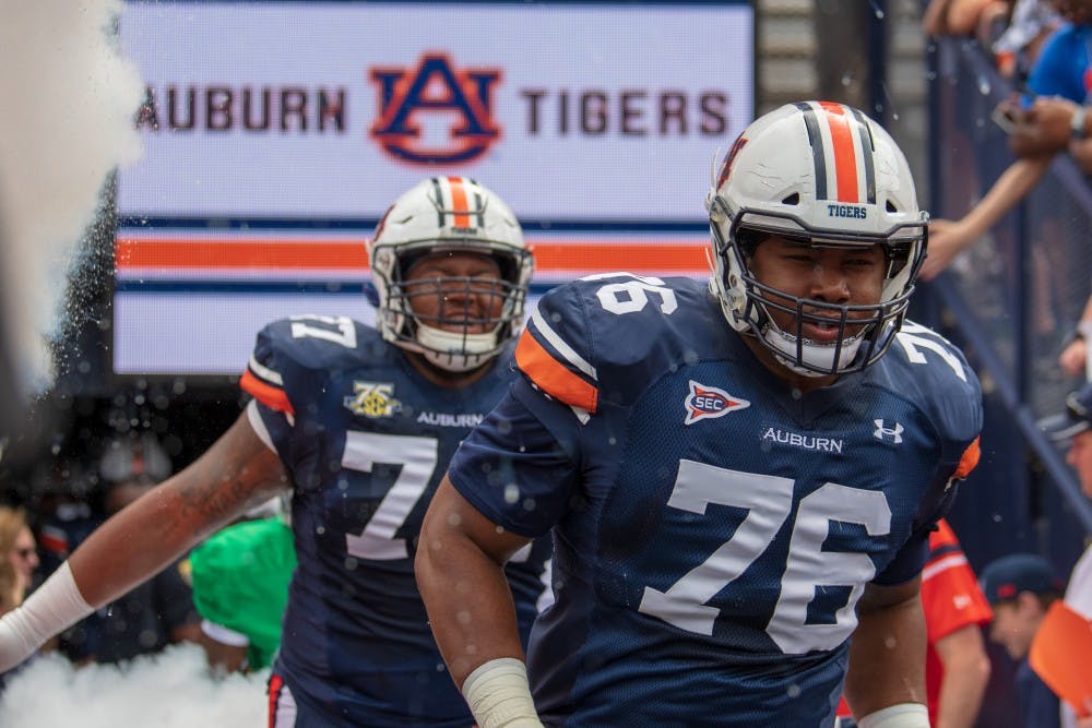 Prince Tega Wanogho (76) runs out of the tunnel during A-Day 2019, on Saturday, April 13, 2019, in Auburn, Ala.