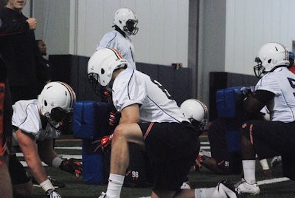 Auburn linemen go through pad drills during spring practice's opening day March 18. (Emily Enfinger / STAFF PHOTOGRAPHER)