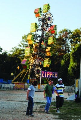 The Zipper is one of about 20 rides providing entertainment on the Midway for Lee County fair-goers. Unlimited ride passes are $20. (Maria Iampietro / PHOTO EDITOR)