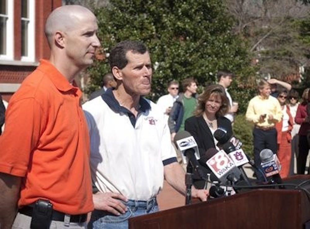 Stephen Enloe, assistant professor of agronomy and soils, and Gary Keever, professor of horticulture, speak to the media during a press conference in front of Samford Hall. (Jillian Clair/NEWS EDITOR)
