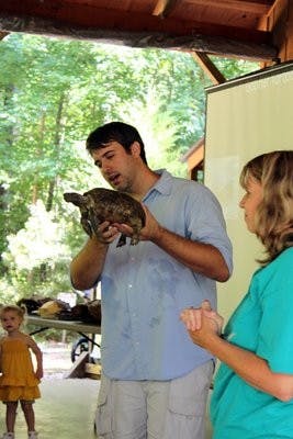 Wes Holland and Jennifer Lolley show kids the different kinds of turtles Saturday at the Ecology Preserve. (Alex Sager / PHOTO EDITOR)