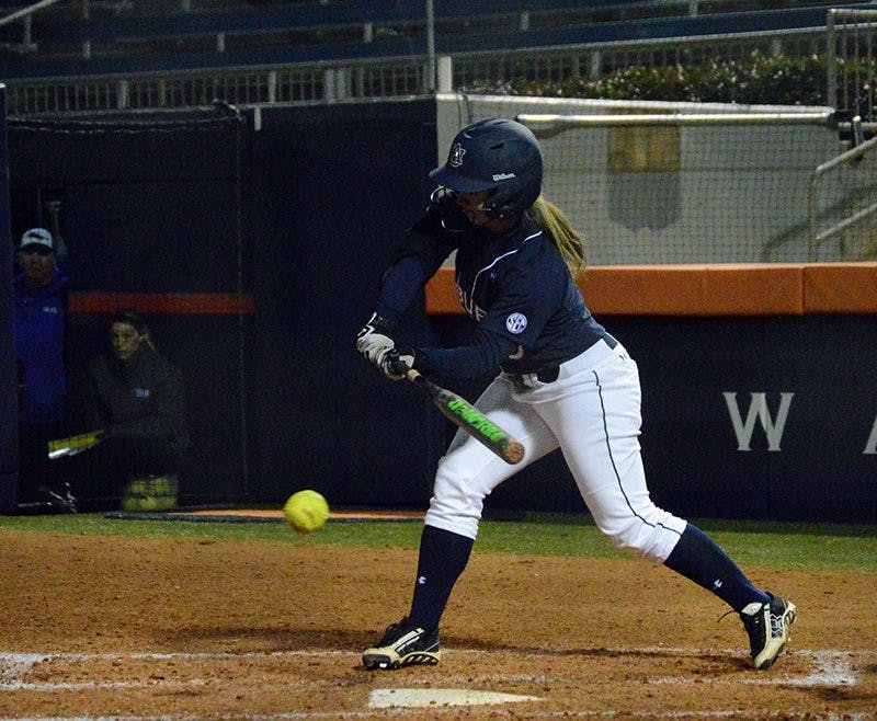 Emily Carosone #5  hits ball. Auburn vs Georgia State in Auburn, AL on Feb 12, 2015. Emily Enfinger | Photo Editor