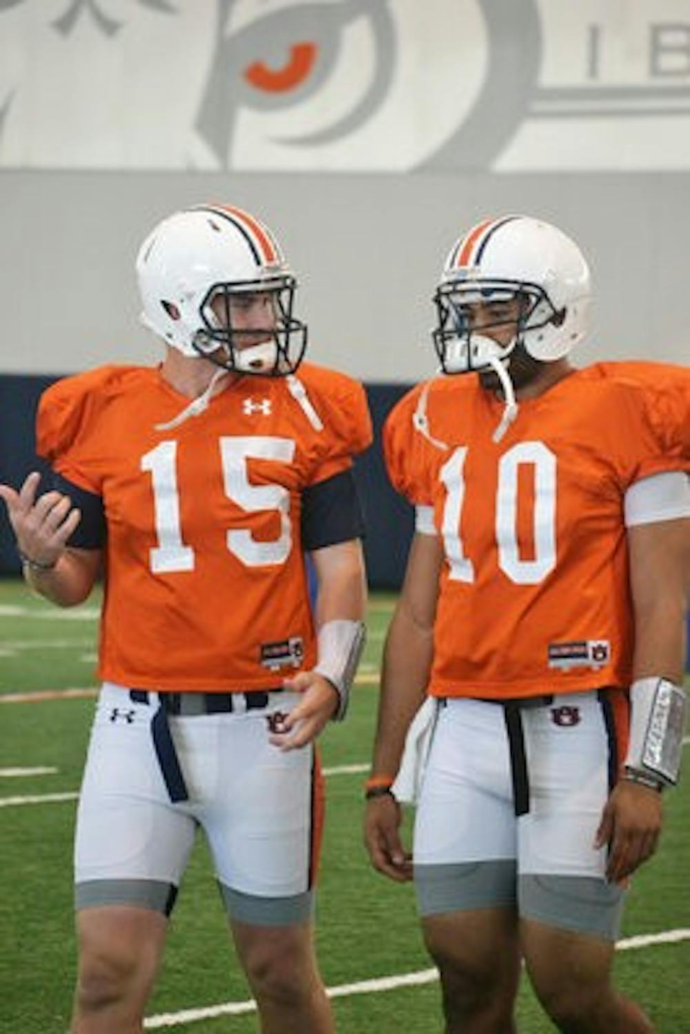 Clint Moseley (left) and Kiehl Frazier (right) talk before practice on August 3. (Danielle Lowe / PHOTO EDITOR)