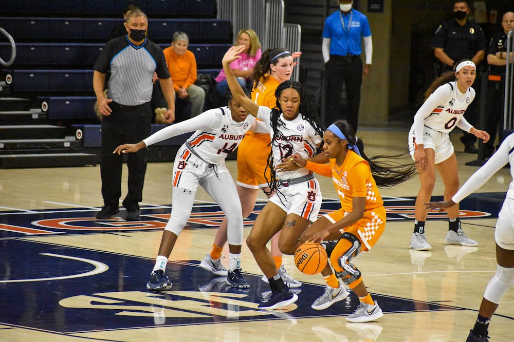 January 27, 2022; Auburn, Alabama; Mar'shaun Bostic (12) defends the paint in a match between Auburn and Tennessee in the Auburn Arena.