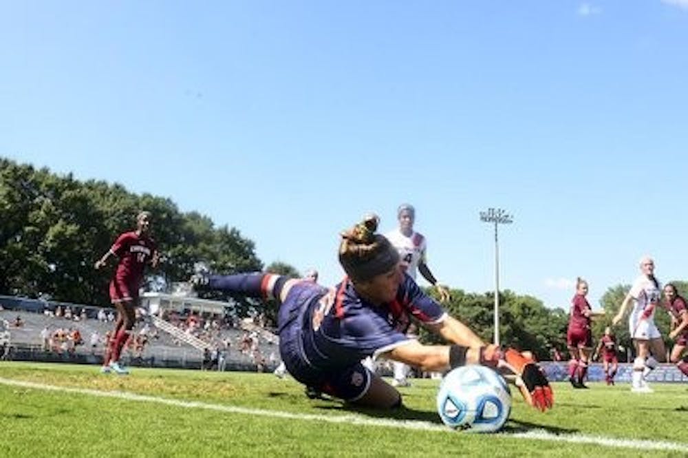 <p>Auburn goalkeeper Alyse Scott makes a diving save in overtime against No. 14 South Carolina.</p>