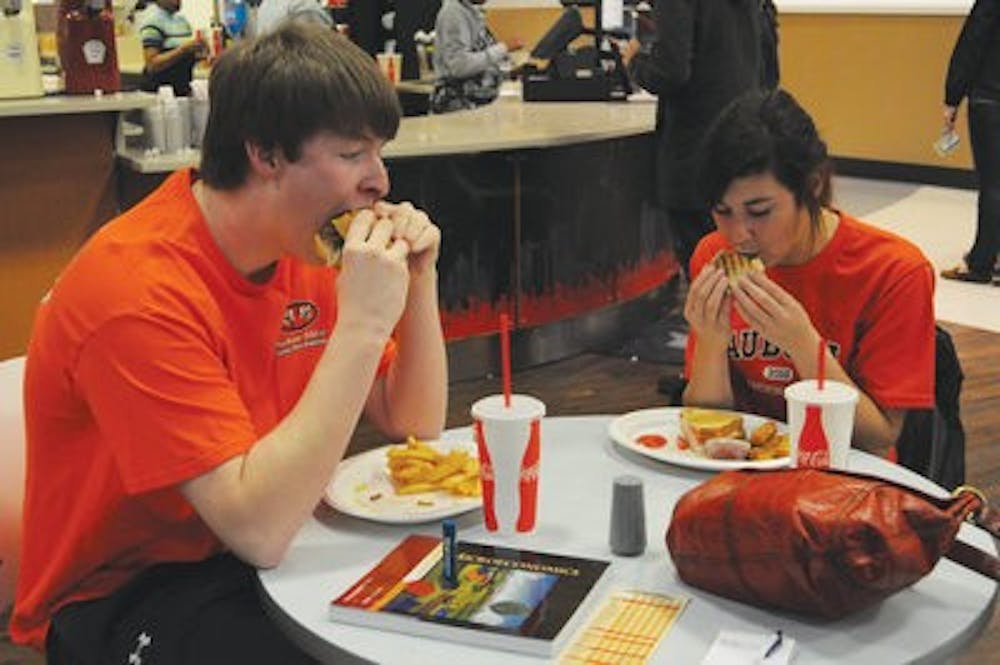 Thomas Stewart, freshman in engineering, and Cady Hobson, freshman in pre-civil engineering, eat dinner at Denny's. (Christen Harned / Assistant Photo Editor)