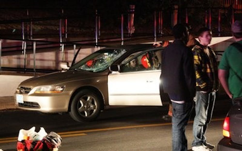 The 21-year-old female driver of a gold Honda Accord was attended to by Auburn Fire Department. Blakeley Sisk/ PHOTO EDITOR