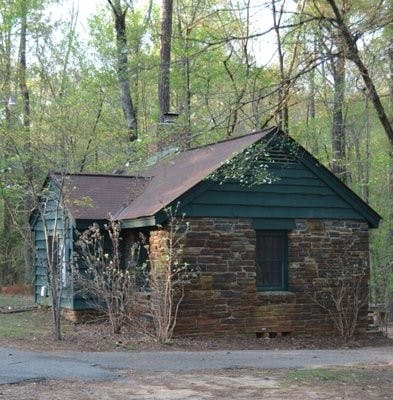 On its 696 acres, Chewacla State Park features many of the original structures, like this cabin, which was built in the 1930s. (FILE PHOTO)