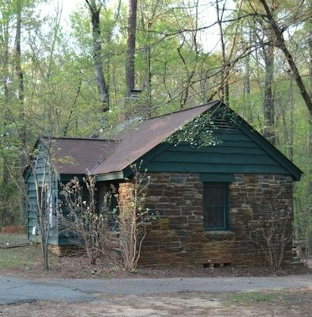 <p>On its 696 acres, Chewacla State Park features many of the original structures, like this cabin, which was built in the 1930s. (FILE PHOTO)</p>
