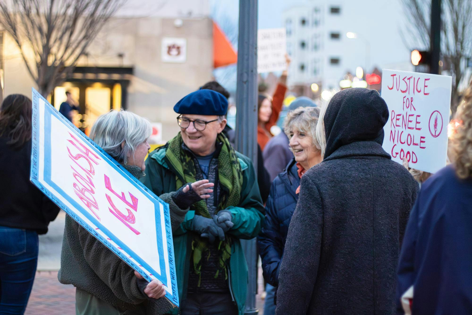 Members of Indivisible Auburn Opelika come together to protest against ICE, Immigration and Customs Enforcement, with their signs at Toomer's Corner on Jan. 21, 2026.