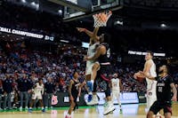 Jabari Smith (10) singles out a defender and puts him on a poster with a dunk in the Tigers' first-round win over Jacksonville State in the NCAA Tournament on March 18, 2022.